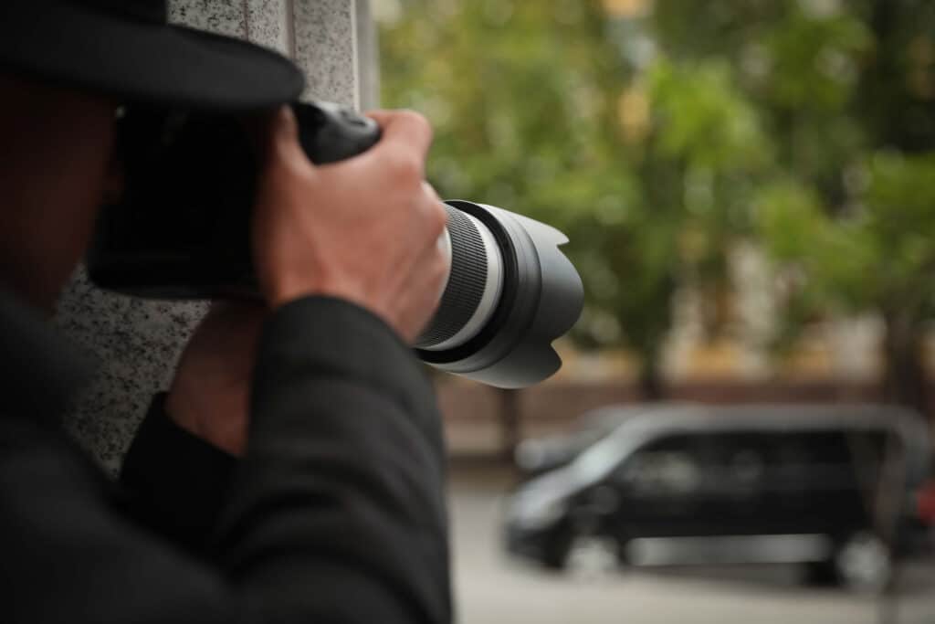 Private investigator taking photos
