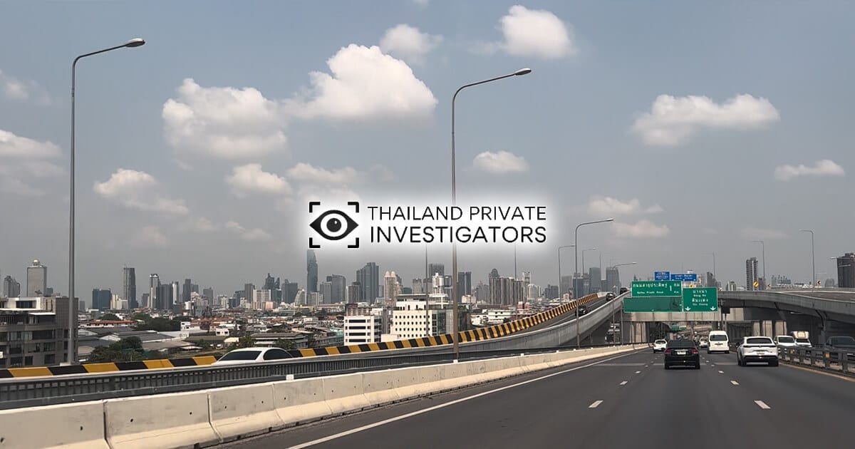 A motorway in Bangkok with skyscrapers in the background and overlaid with the Thailand Private Investigators logo